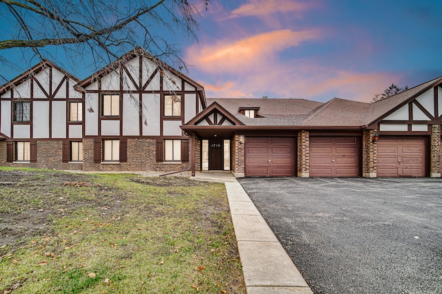 tudor-style house with a garage