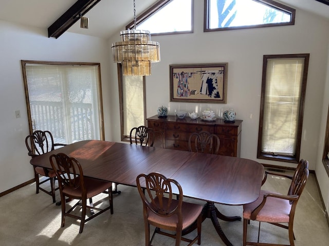 dining area featuring light carpet, vaulted ceiling with beams, and a notable chandelier