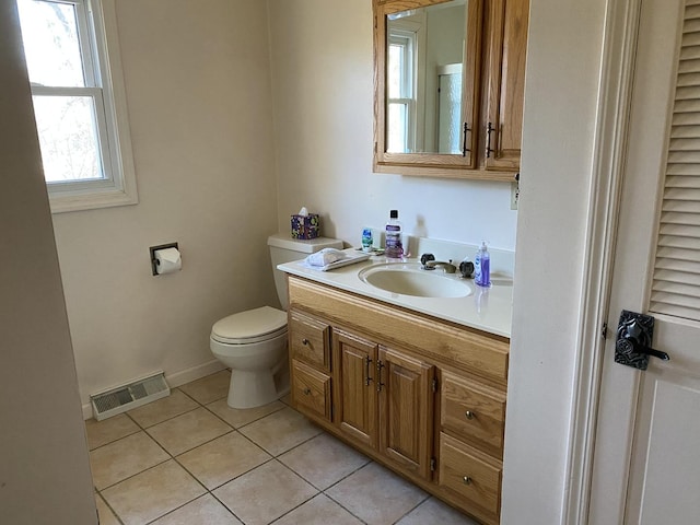 bathroom with tile patterned floors, vanity, and toilet