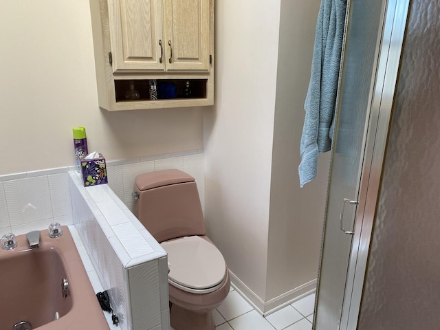 bathroom featuring tile patterned floors, sink, and toilet