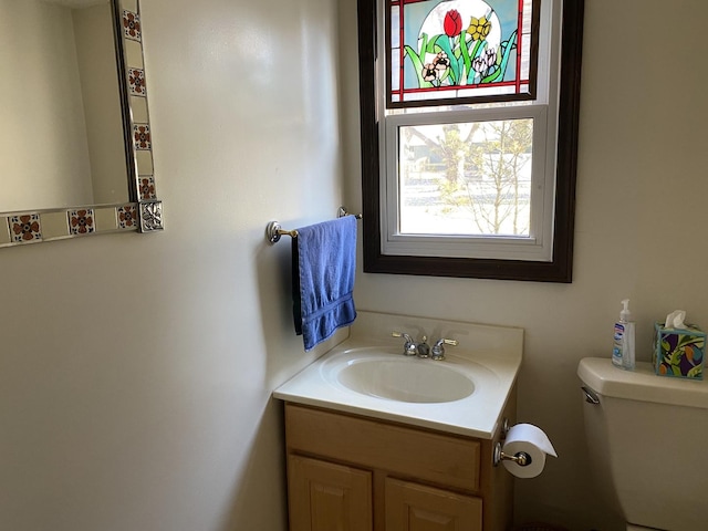 bathroom with vanity and toilet