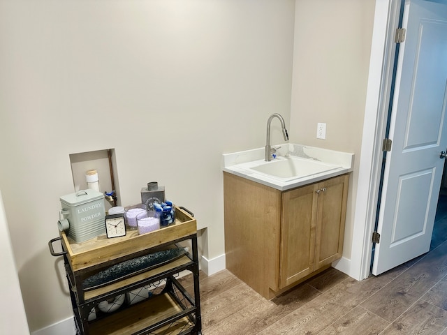 bathroom with sink and hardwood / wood-style floors