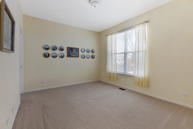 view of carpeted spare room