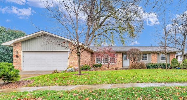 ranch-style house featuring a front yard and a garage