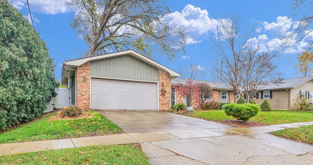 ranch-style house with a garage and a front yard