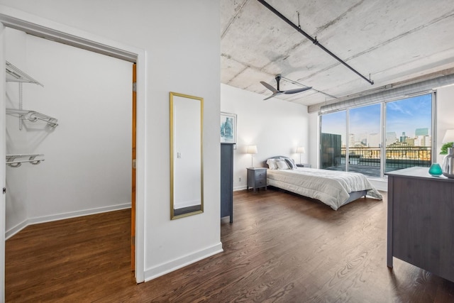 bedroom with dark hardwood / wood-style flooring and access to outside