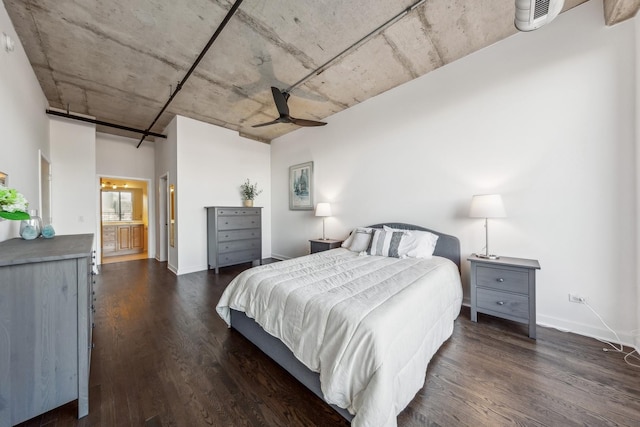 bedroom featuring connected bathroom, ceiling fan, and dark hardwood / wood-style floors