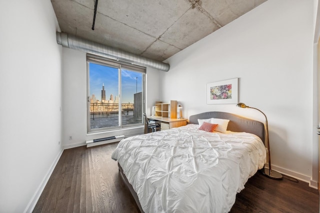 bedroom with dark hardwood / wood-style flooring