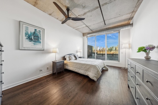 bedroom featuring ceiling fan and dark hardwood / wood-style floors