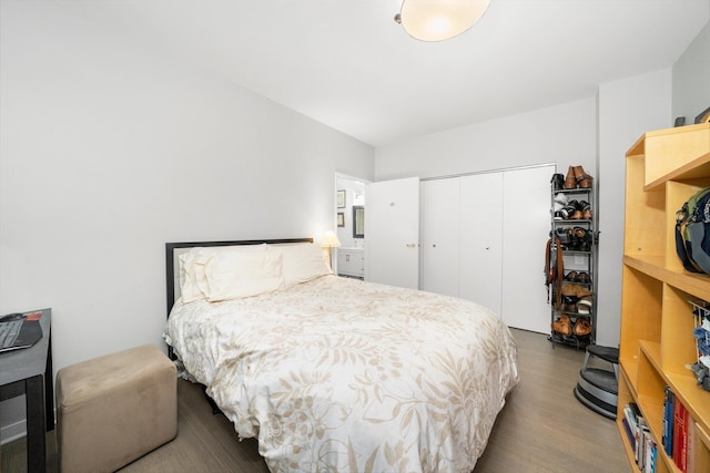 bedroom featuring hardwood / wood-style flooring and a closet