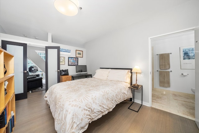 bedroom with hardwood / wood-style floors