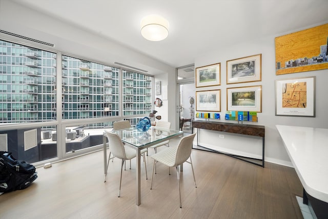 dining space featuring hardwood / wood-style flooring