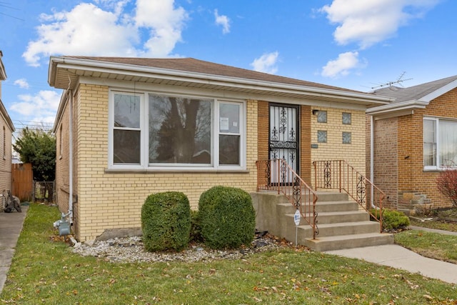 view of front of home with a front lawn