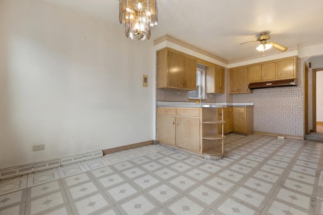 kitchen featuring ceiling fan with notable chandelier and a baseboard radiator