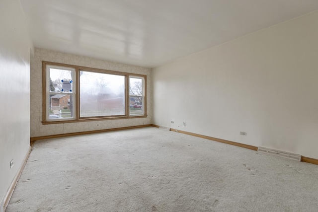 unfurnished room featuring carpet floors