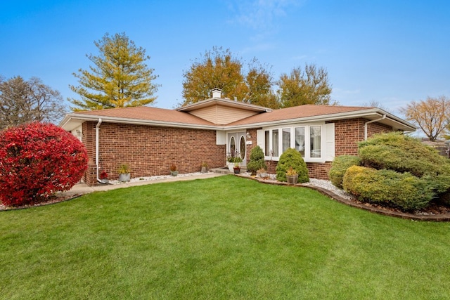 single story home with a front yard