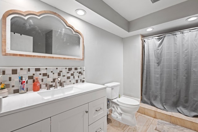 bathroom with a shower with curtain, decorative backsplash, vanity, and toilet