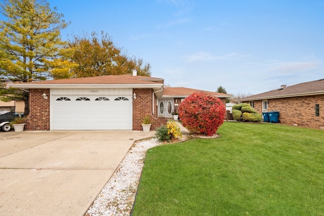 ranch-style home with a front lawn and a garage