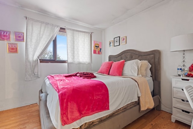 bedroom featuring light wood-type flooring