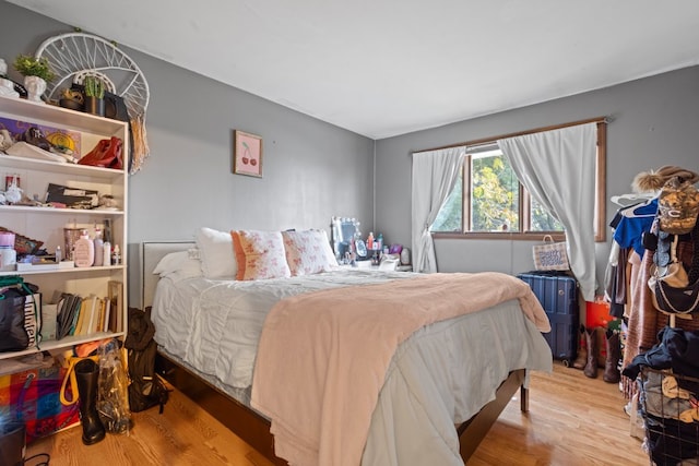 bedroom with hardwood / wood-style floors