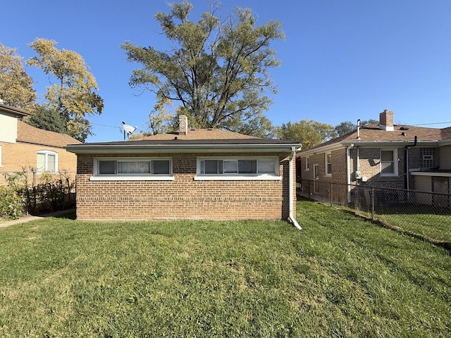 back of house with a yard