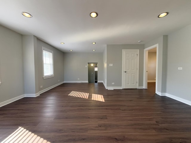 empty room featuring dark hardwood / wood-style flooring