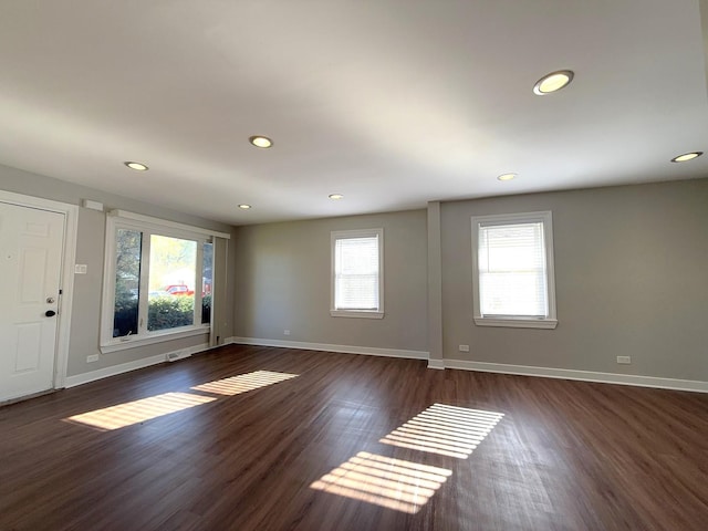 spare room with dark hardwood / wood-style flooring