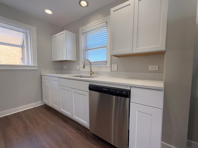 kitchen with white cabinets, dishwasher, and a wealth of natural light