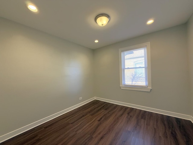 empty room featuring dark hardwood / wood-style flooring