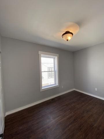 empty room featuring dark hardwood / wood-style floors