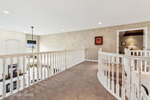 hallway with carpet floors