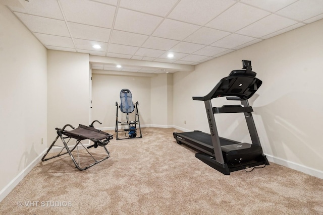 workout room featuring a drop ceiling and carpet