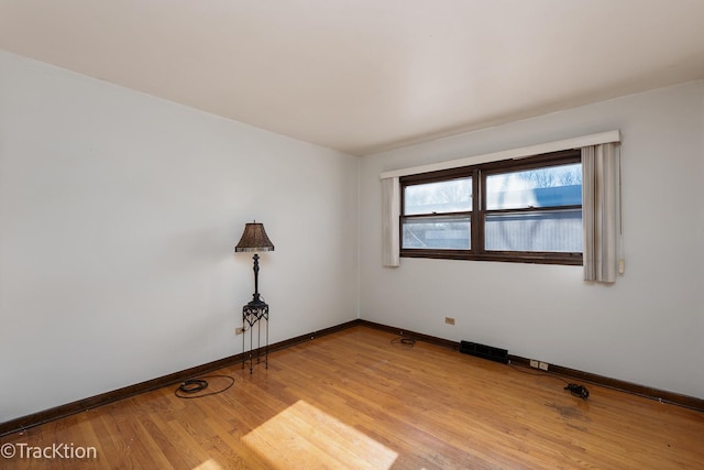 empty room with light hardwood / wood-style floors