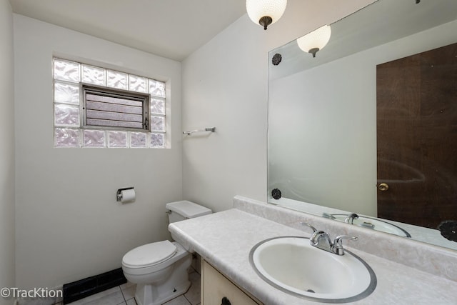 bathroom with vanity, tile patterned floors, and toilet