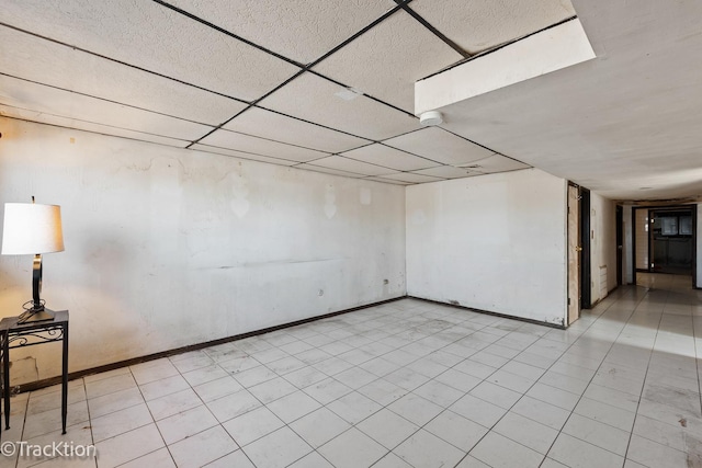 spare room featuring a drop ceiling