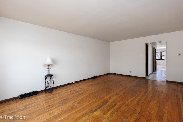 empty room featuring hardwood / wood-style flooring