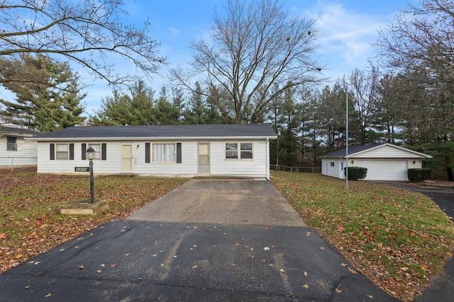 view of front of property featuring a front yard and a garage