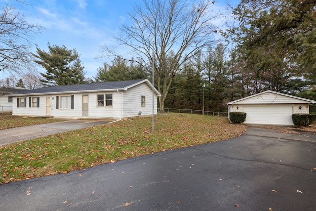 view of front of home with a garage and a front lawn