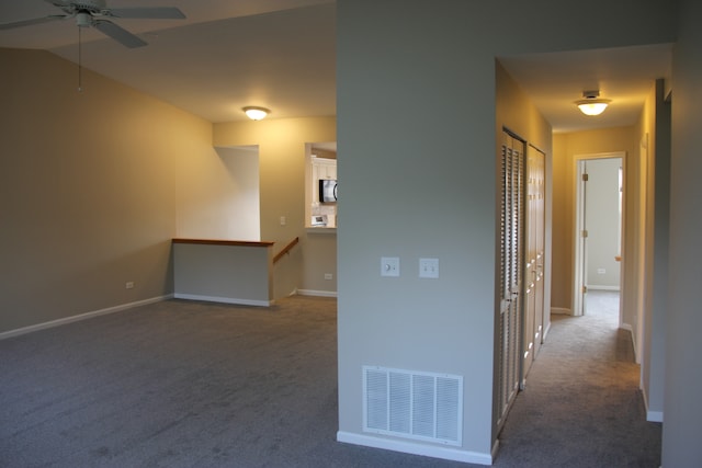 interior space featuring ceiling fan