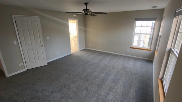 carpeted empty room featuring ceiling fan