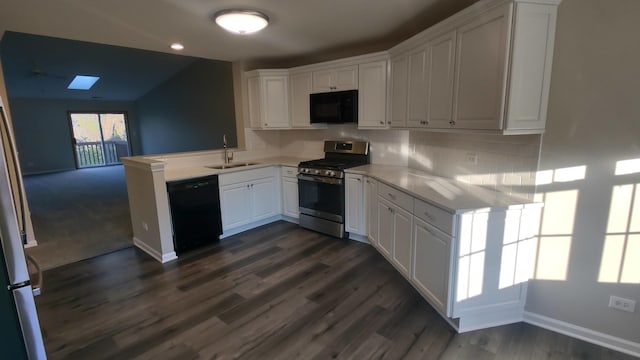 kitchen featuring kitchen peninsula, dark wood-type flooring, sink, black appliances, and white cabinetry