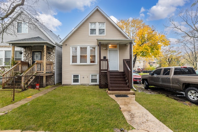 bungalow-style house featuring a front yard