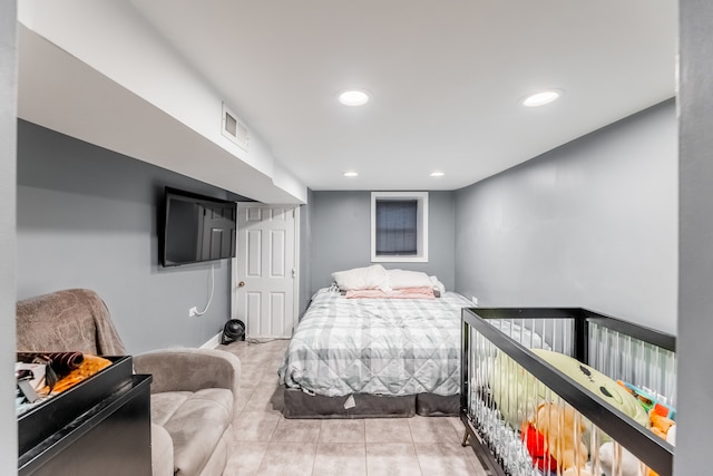 bedroom featuring light tile patterned flooring