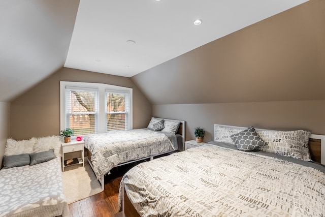 bedroom featuring dark hardwood / wood-style flooring and lofted ceiling