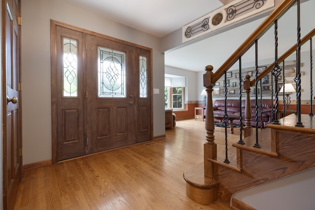 entryway with light hardwood / wood-style floors