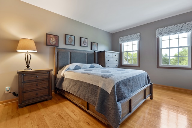 bedroom with light hardwood / wood-style flooring