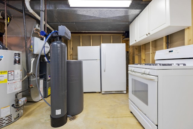 interior space featuring white cabinets, white appliances, and water heater