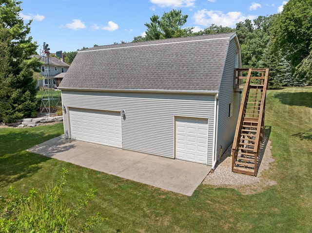 garage with a yard