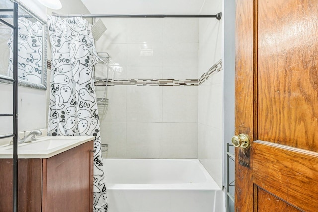 bathroom with shower / tub combo with curtain and vanity