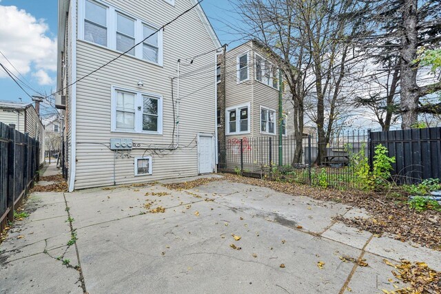 back of property with a patio